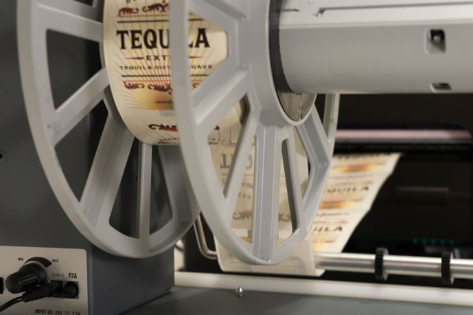 NeuraLabel 300x ST straight through roll to roll system with tequila labels