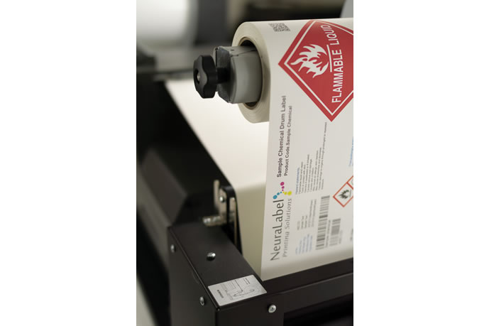 NeuraLabel high capacity roll to roll digital labeling solution closeup of ghs labels