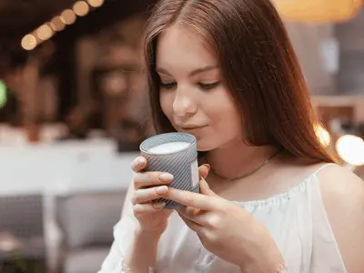 Woman smelling a candle